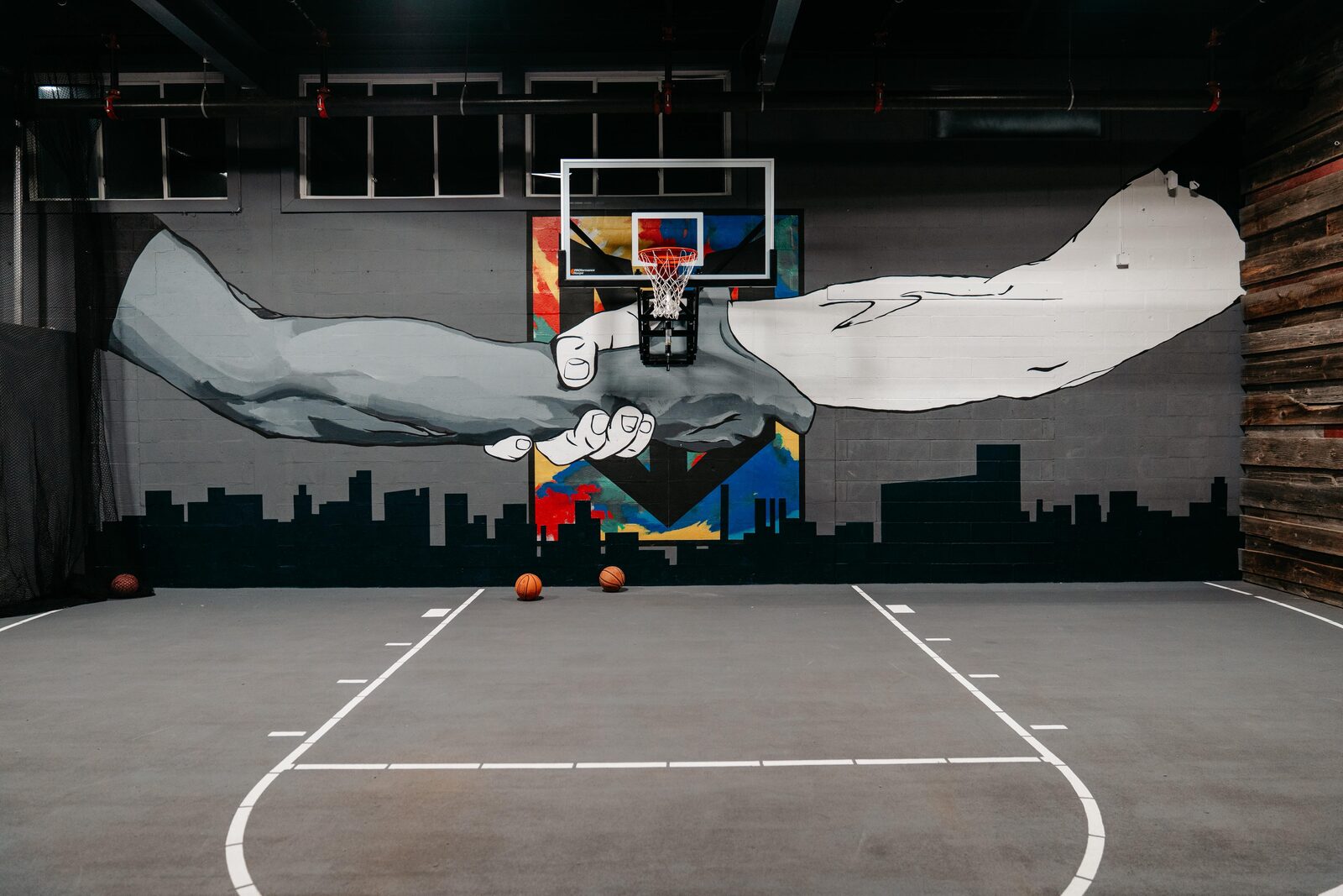 Basketball court mural inside The Workout Yard gym in Everett, MA